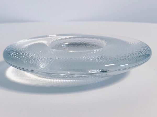 Afbeelding van de Iittala Nappi waxinelichthouder transparant die in deze advertentie wordt aangeboden.