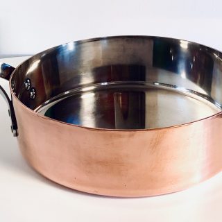 Image of a Georg Jensen copper sauté pan designed by Henning Koppel offered in this advertisement.