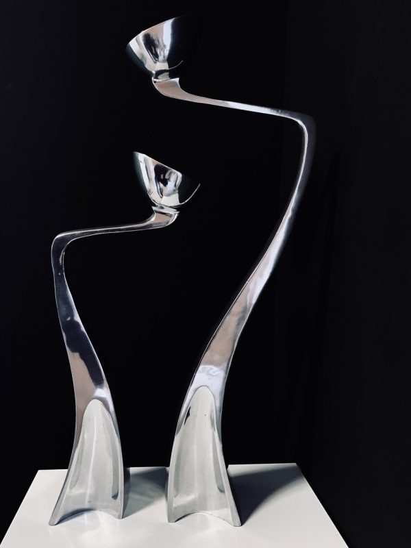 Image of the Matthew Hilton Swan Arclumis candle holders offered in this advertisement.
