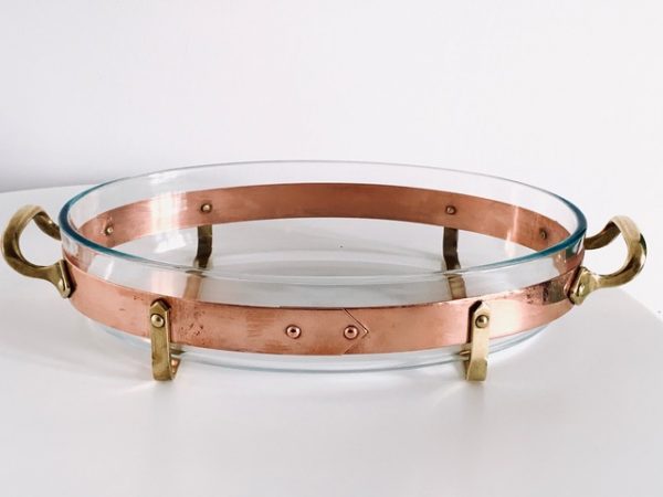 Image of the copper and brass vintage Nilsjohan baking dish medium in the shape oval offered in this advertisement.