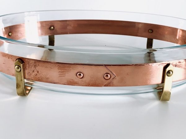 Image of the copper and brass vintage Nilsjohan baking dish medium in the shape oval offered in this advertisement.