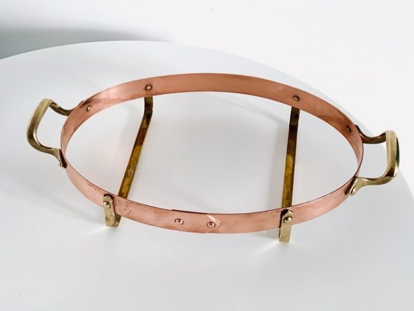 Image of the copper and brass vintage Nilsjohan baking dish medium in the shape oval offered in this advertisement.