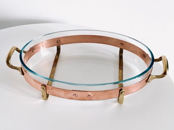Image of the copper and brass vintage Nilsjohan baking dish medium in the shape oval offered in this advertisement.