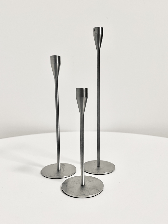 Image of the Piet Hein MINI candlesticks stainless steel set of 3 offered in this advertisement.
